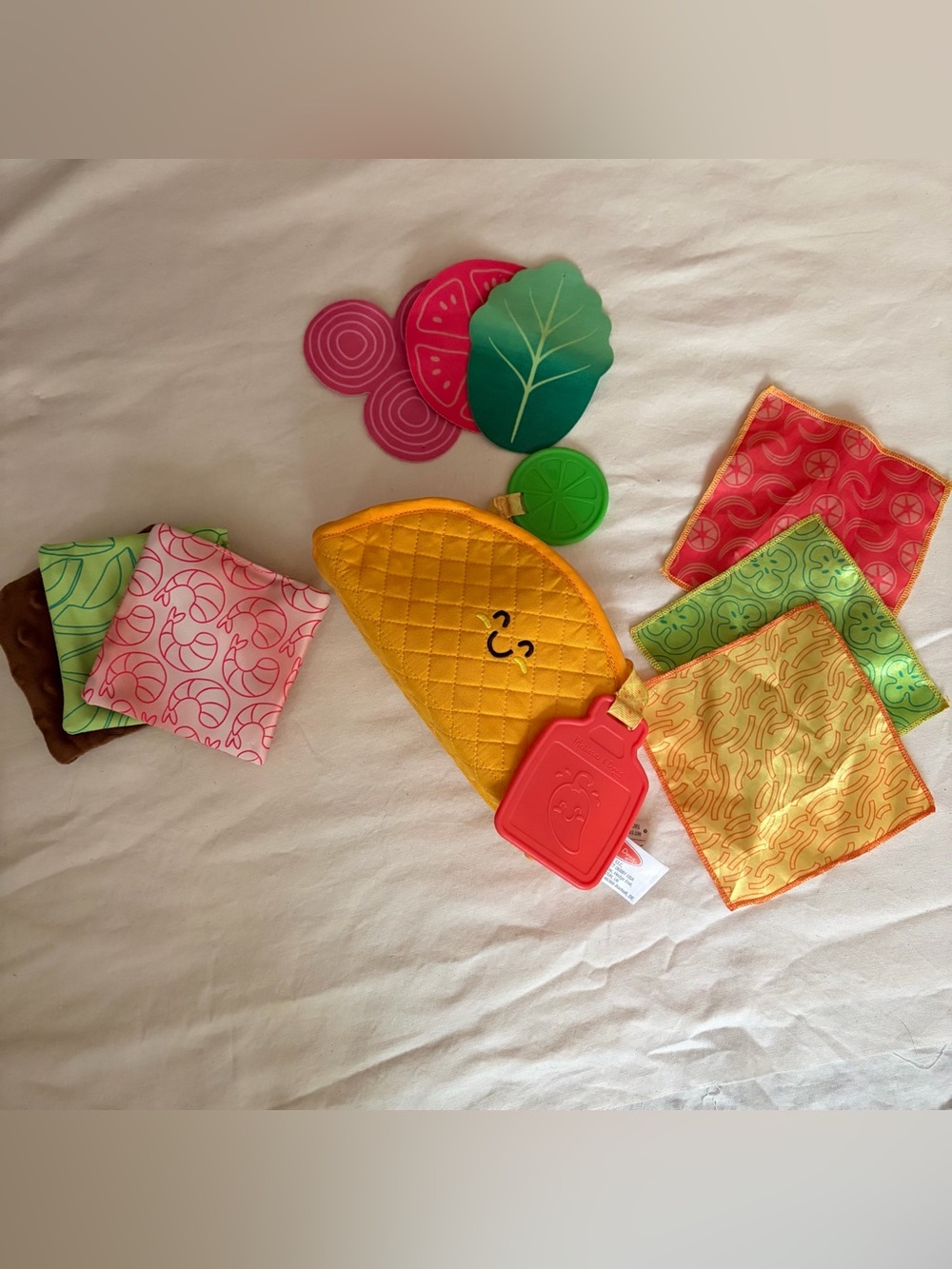 Melissa & Doug Multi-Sensory Soft Taco Fill and Spill Baby toy